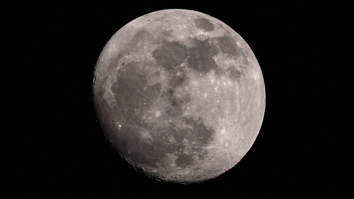 The Waxing Gibbous moon rises in the sky over Bogota on August 17, 2024